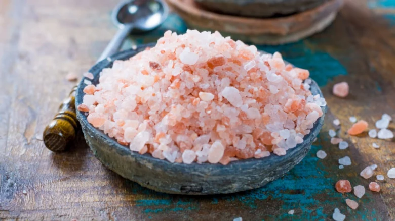 Pink salt crystals in bowl