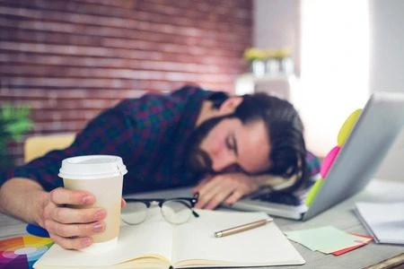 Tired man at desk