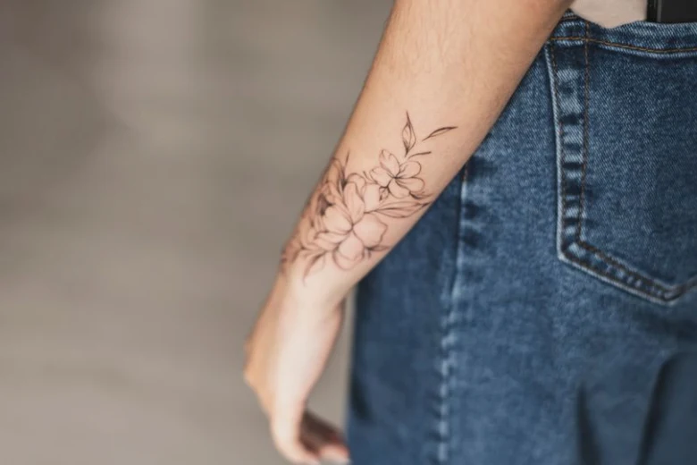 Arm with floral tattoo