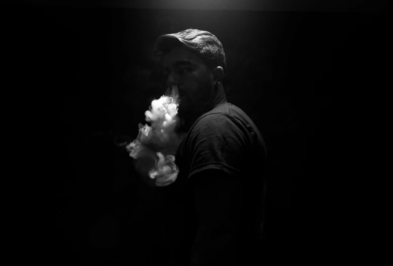 Man exhaling vapor