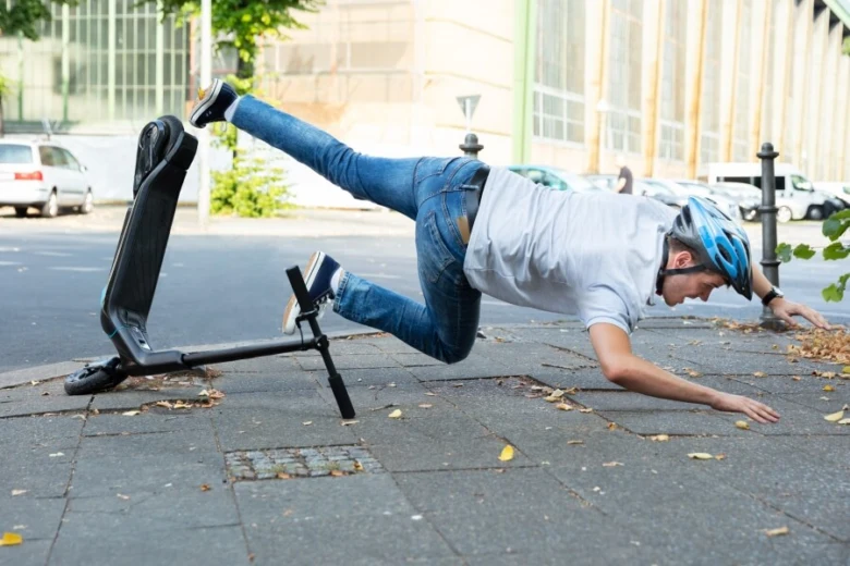 Person falling with scooter