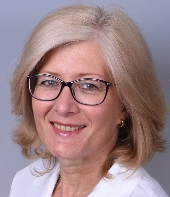 Woman with glasses and blonde hair
