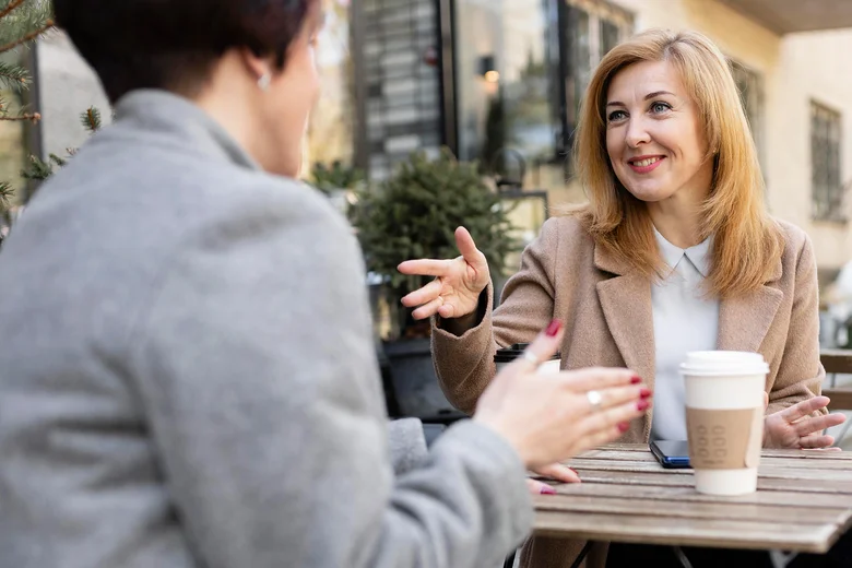 Two women talking outdoors