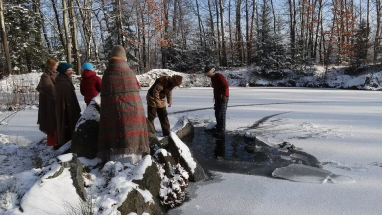 People on frozen lake winter solstice