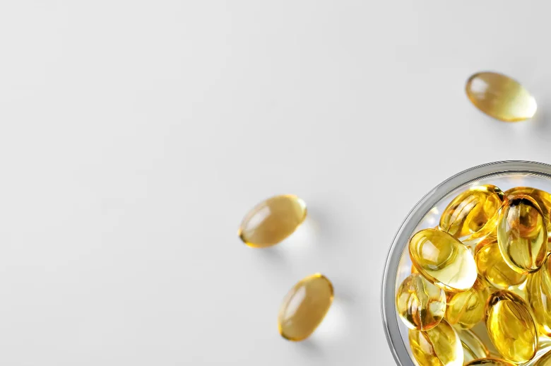 Yellow capsules in bowl