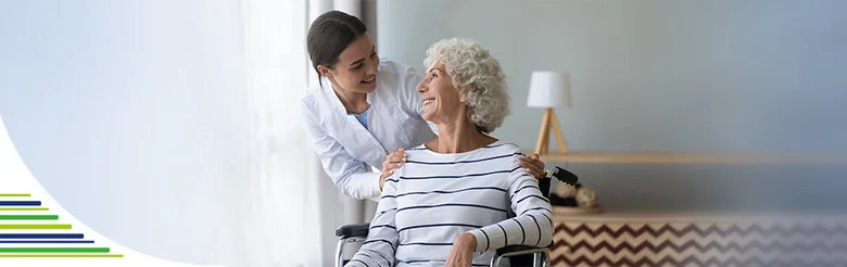 Caregiver and elderly woman in wheelchair