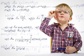 Boy with glasses and math equations