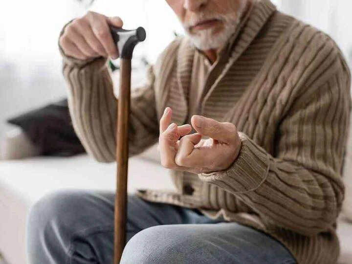 Elderly man with cane